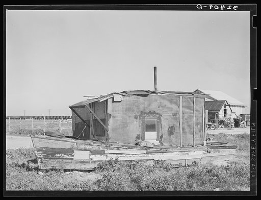 House of squatter on Nueces Bay. House is made of old boat. Corpus Christi, Texas