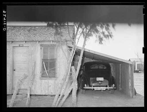Untitled photo, possibly related to: House, garage and new car of Mexican. Crystal City, Texas. It is common practice for the Mexicans on returning from the beet fields of Minnesota and North Dakota and Colorado to make first payments on cars. Even the more prosperous Mexicans live in these one- and