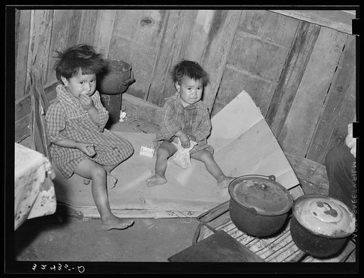 Mexican children in kitchen. San Antonio, Texas