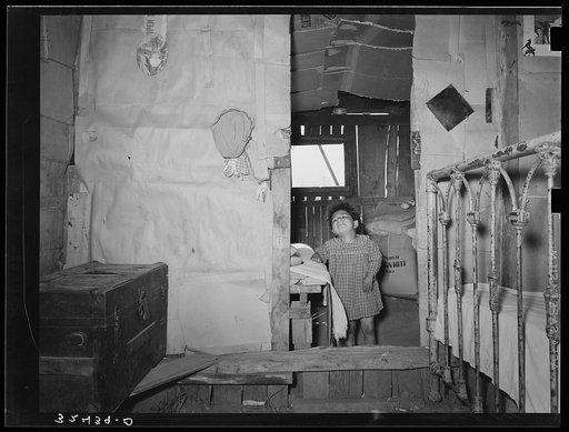 Looking into bedroom from living room of Mexican house in the outskirts of San Antonio, Texas