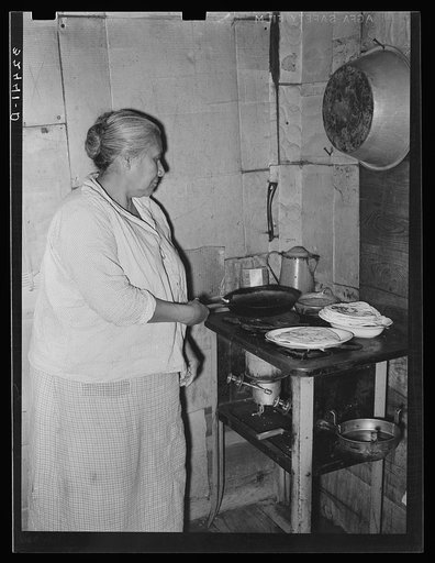 Mexican woman cooking tortillas. San Antonio, Texas