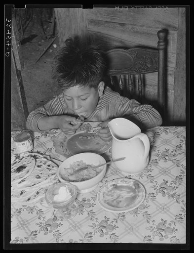 Mexican boy eating lunch. San Antonio, Texas