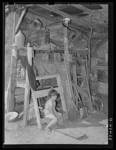 Mexican girl in storage shed. San Antonio, Texas