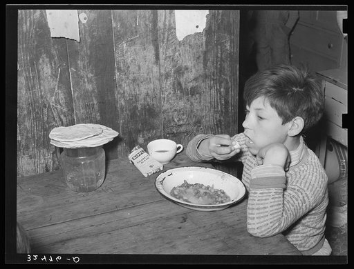 Mexican boy eating lunch. San Antonio, Texas