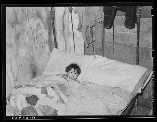 Mexican boy sick in bed. San Antonio, Texas