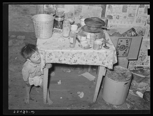 Mexican child in kitchen. San Antonio, Texas