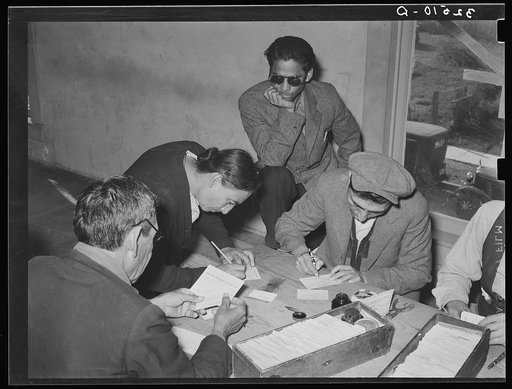 Mexican pecan worker being assigned to work by union. San Antonio, Texas