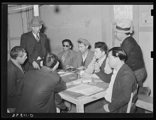 Mexican pecan workers union work committee assigning a man to work. San Antonio, Texas