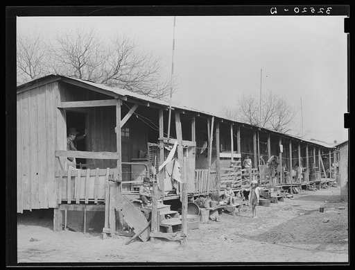 Untitled photo, possibly related to: Row of houses facing on corral. San Antonio, Texas