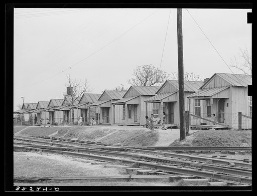 Row of houses along the railroad track. Mexican quarter, San Antonio, Texas