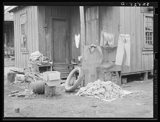 Clothing and personal belongings outside of house in Mexican quarter. San Antonio, Texas