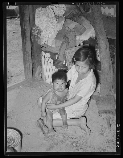 Mexican children in kitchen. San Antonio, Texas