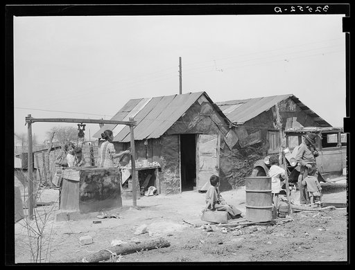 House and yard of Mexican family. San Antonio, Texas