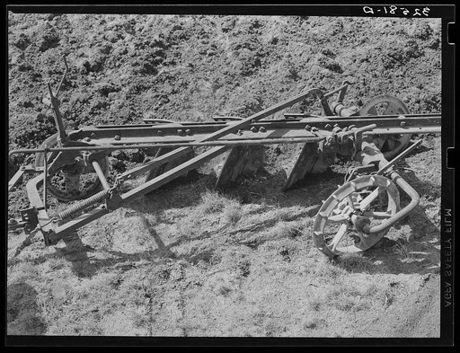 Detail of disk plow breaking virgin sod. El Indio, Texas