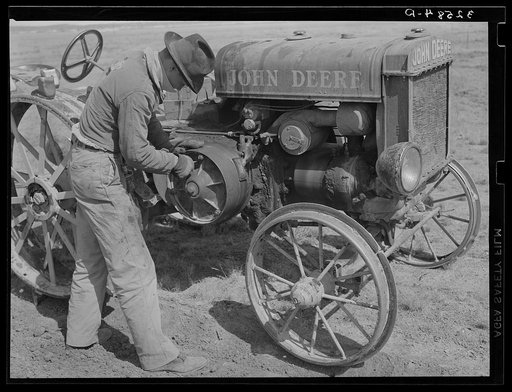 Son of pioneer at El Indio, Texas, repairing clutch on tractor