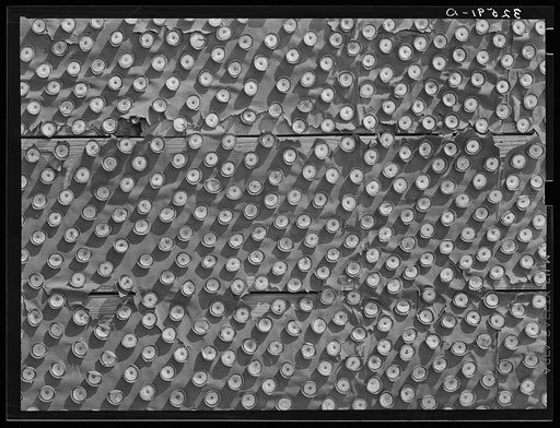 Detail of bottle caps decorating abandoned theater. Quemado, Texas