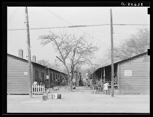 Row of houses facing on corral. Mexican section, San Antonio, Texas