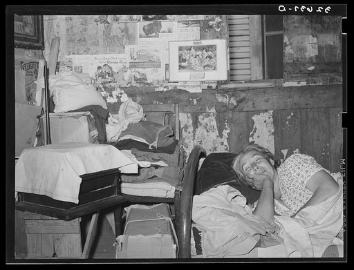 Untitled photo, possibly related to: Mexican woman resting on bed in her home. San Antonio, Texas
