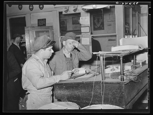Looking over the day's orders in a commission house adjacent to the large fruit and vegetable market in San Antonio, Texas