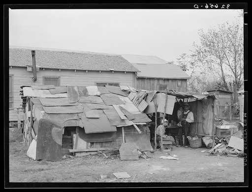 Squatters in Mexican section in San Antonio, Texas. House was built of scrap material in vacant lot in Mexican section of San Antonio, Texas