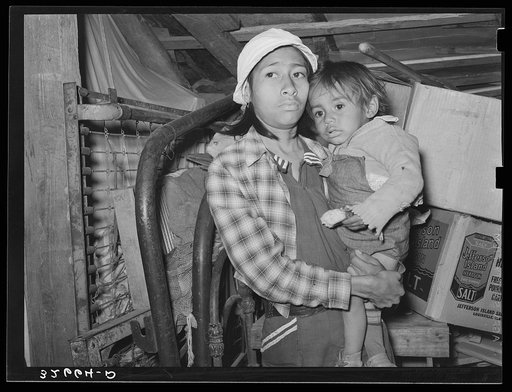 Mexican mother and child in shack home. San Antonio, Texas