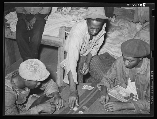 Poker game in Negro strawberry workers' bunkhouse. Hammond, Louisiana