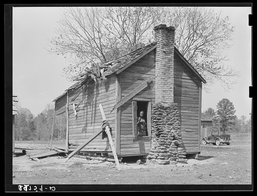 Untitled photo, possibly related to: Cabin of Negroes living near Jefferson, Texas. This family owned about thirty acres but were not farming it, doing day labor for a living