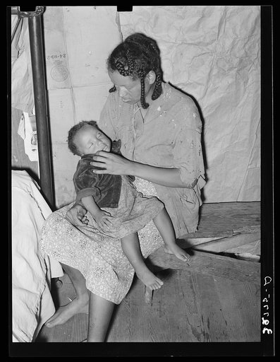 Negro strawberry picker with her baby. Independence, Louisiana