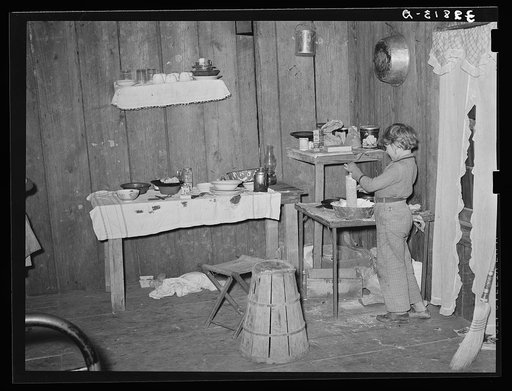 Interior of temporary home of white migrant strawberry pickers near Ponchatoula, Louisiana