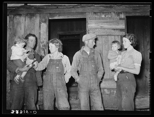 Two young couples with their children. These are migratory berry pickers near Ponchatoula, Louisiana