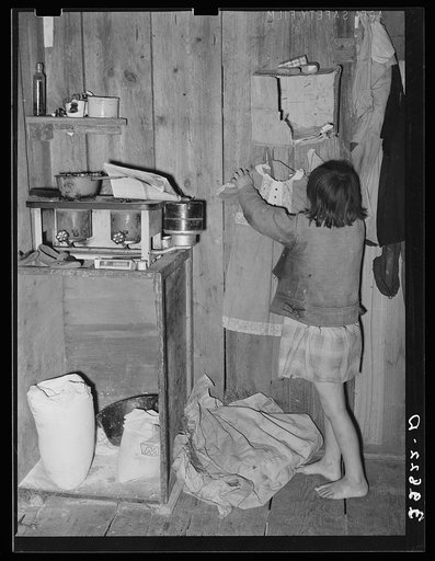 Corner of combined kitchen- bedroom in house provided for migratory berry pickers near Ponchatoula, Louisiana