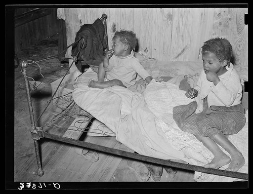 Children of Negro family who do odd jobs on strawberry farm near Hammond, Louisiana