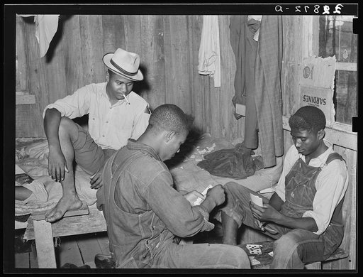 Game of "coon-can" played by group of Negroes in bunkhouse of strawberry pickers near Hammond, Louisiana