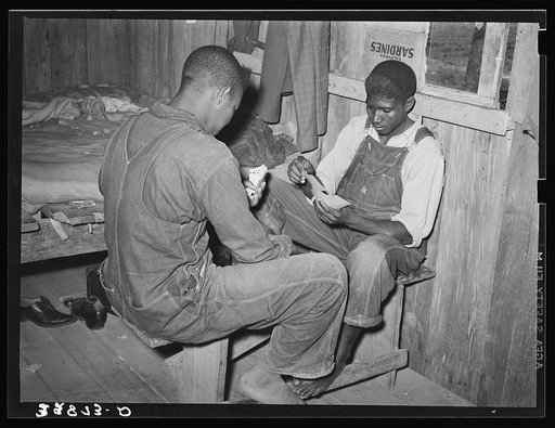 Game of "coon-can" played by group of Negroes in bunkhouse of strawberry pickers near Hammond, Louisiana