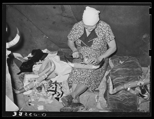 White migrant woman finishing an ornament made of horns. They depend upon the sale of these ornaments for a living. Hammond, Louisiana