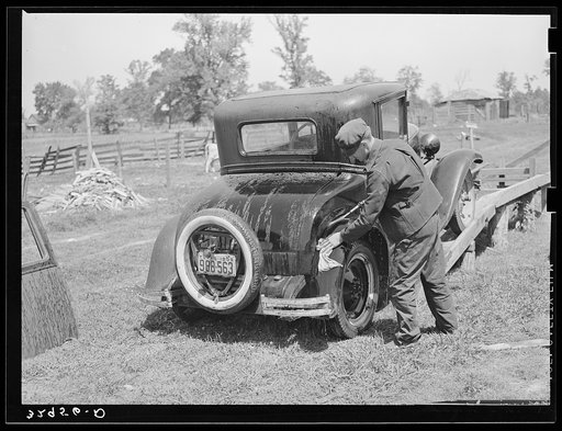 Washing automobile. San Augustine, Texas