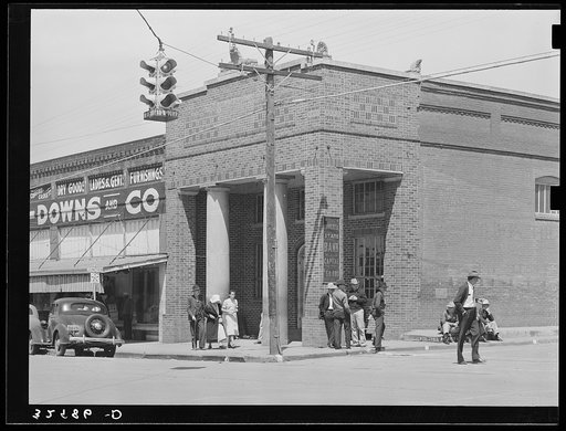Untitled photo, possibly related to: Bank corner on main street. San Augustine, Texas