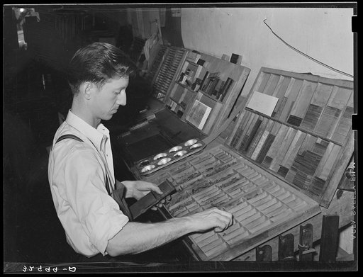 Setting type by hand. Newspaper office. San Augustine, Texas