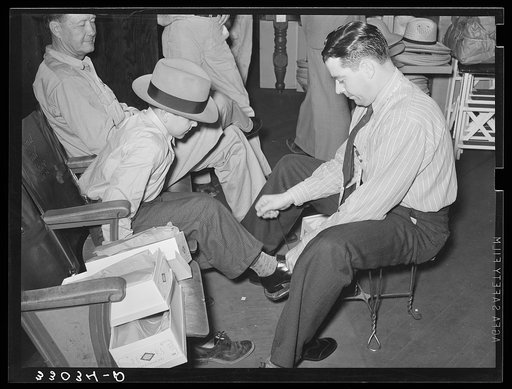 Trying on a pair of shoes. San Augustine, Texas