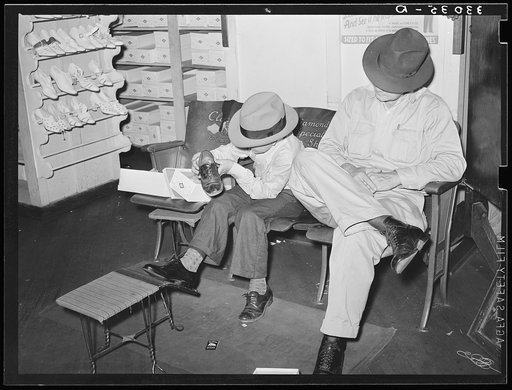 Trying on a new pair of shoes. San Augustine, Texas