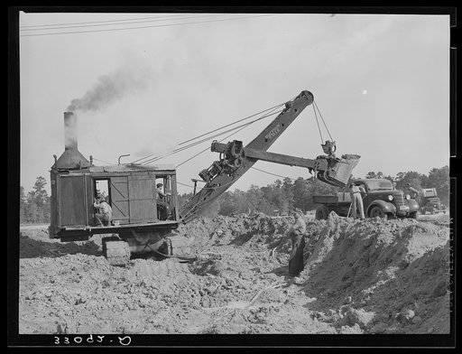 Steam shovel at work at paper mill. Lufkin, Texas