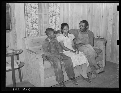 Untitled photo, possibly related to: FSA (Farm Security Administration) family in living room of home. Sabine Farms, Marshall, Texas