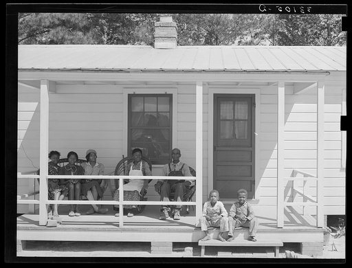 Family of FSA (Farm Security Administration) client on front porch of their home. Sabine Farms, Marshall, Texas