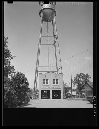 Untitled photo, possibly related to: Fire station and water tank. Carthage, Texas