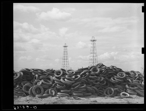 Piles of worn-out automobile tires in oil fields at Kilgore, Texas. Bad roads and heavy trucking in the oil fields cause great wear on both tires and automobiles