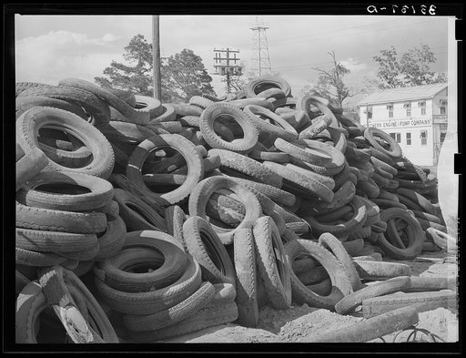 Piles of worn-out automobile tires in oil fields at Kilgore, Texas. Bad roads and heavy trucking in the oil fields cause great wear on both tires and automobiles