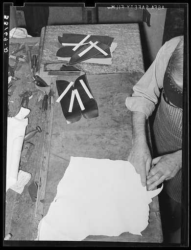 Cutting out the beading for boots. Bootmaking shop, Alpine, Texas. This beading is a binding on the upper part of the boots