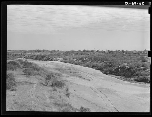 Untitled photo, possibly related to: Wagon tracks down the dry bed of the Colorado River at Colorado, Texas. Rivers and streams of the Southwest are often dry during periods of drought