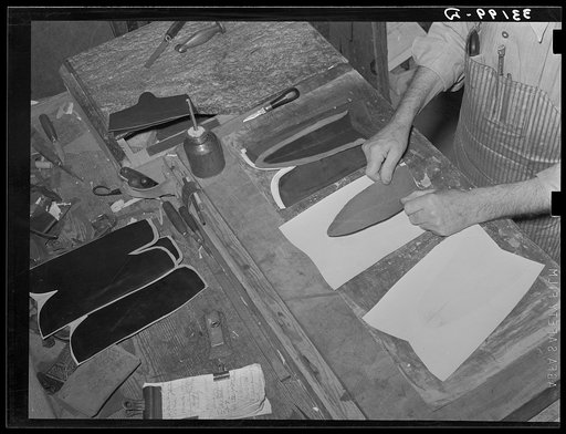 Gluing lining into upper part of boot. Bootmaking shop, Alpine, Texas