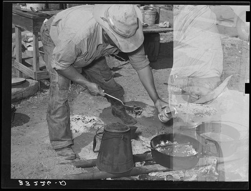 Untitled photo, possibly related to: Camp cook at work with chuckwagon in background. Cattle ranch near Marfa, Texas